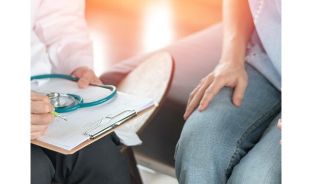 couple talking with tthe doctor