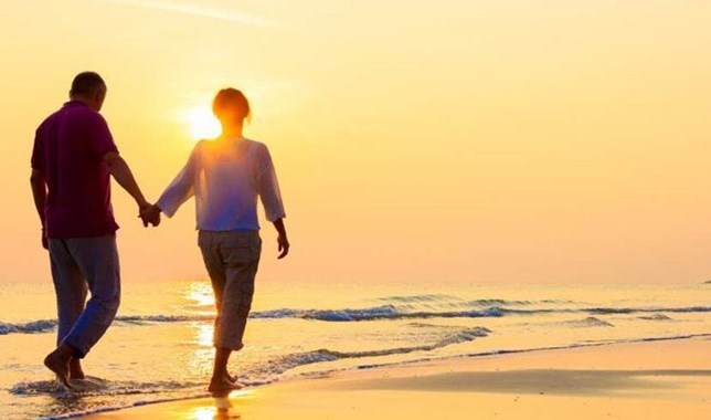 Couple walking on the beach