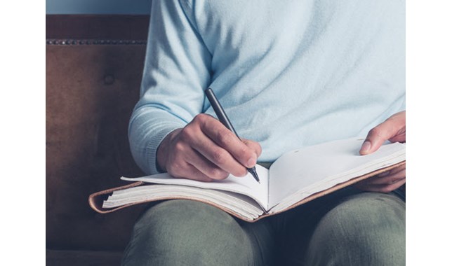 Writing in a notebook