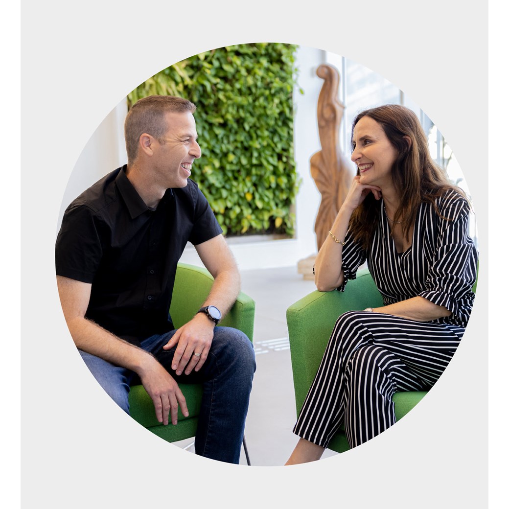 Employees talking in office Israel